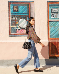Sandra carrying the Black Suede and Nappa Belle as a crossbody bag. 