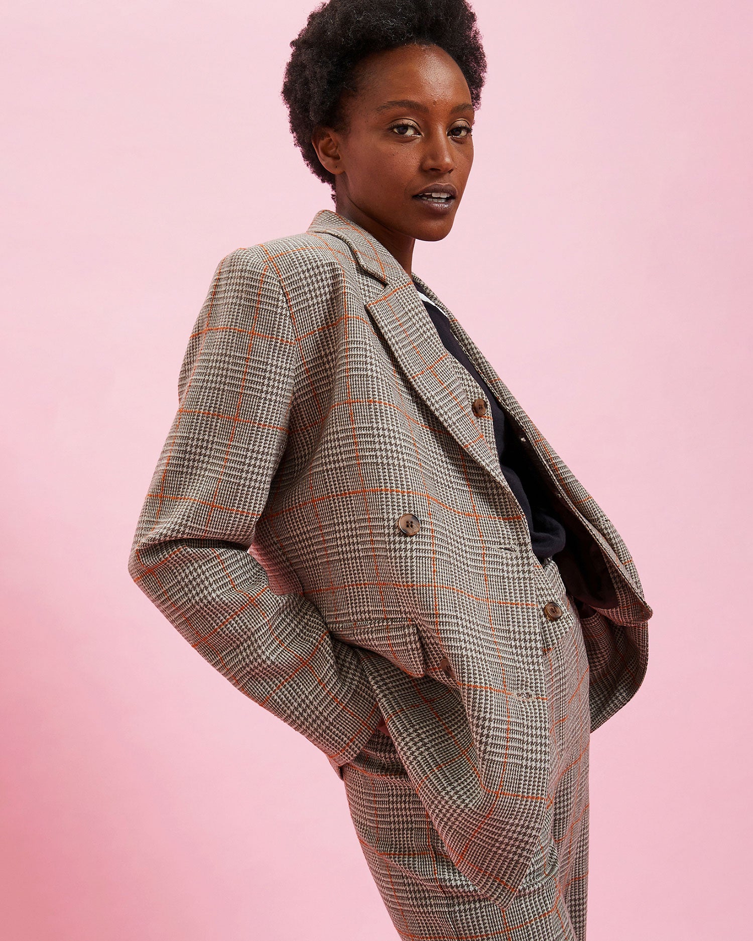 Model wearing the Grey Plaid w/ Orange Stitch Blazer with the matching pants