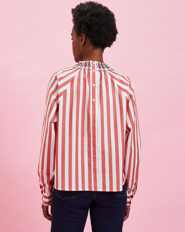 back view of the model wearing the Poppy & Cream Stripes Blouse with jeans