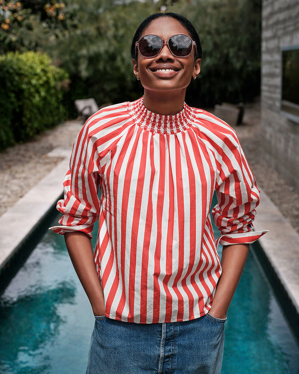 Mecca wearing the Poppy & Cream Stripes Blouse.