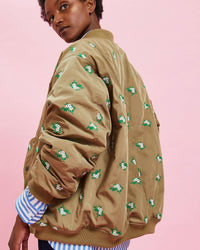 model wearing the Khaki Bomber Jacket over a striped longsleeve shirt