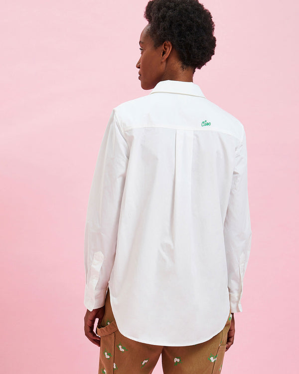 back view of the model wearing the White w/ Green Embroidered Ciao Button Up Shirt