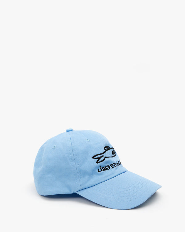 side view of the Sky Blue Liberez Les Sardines Baseball Hat