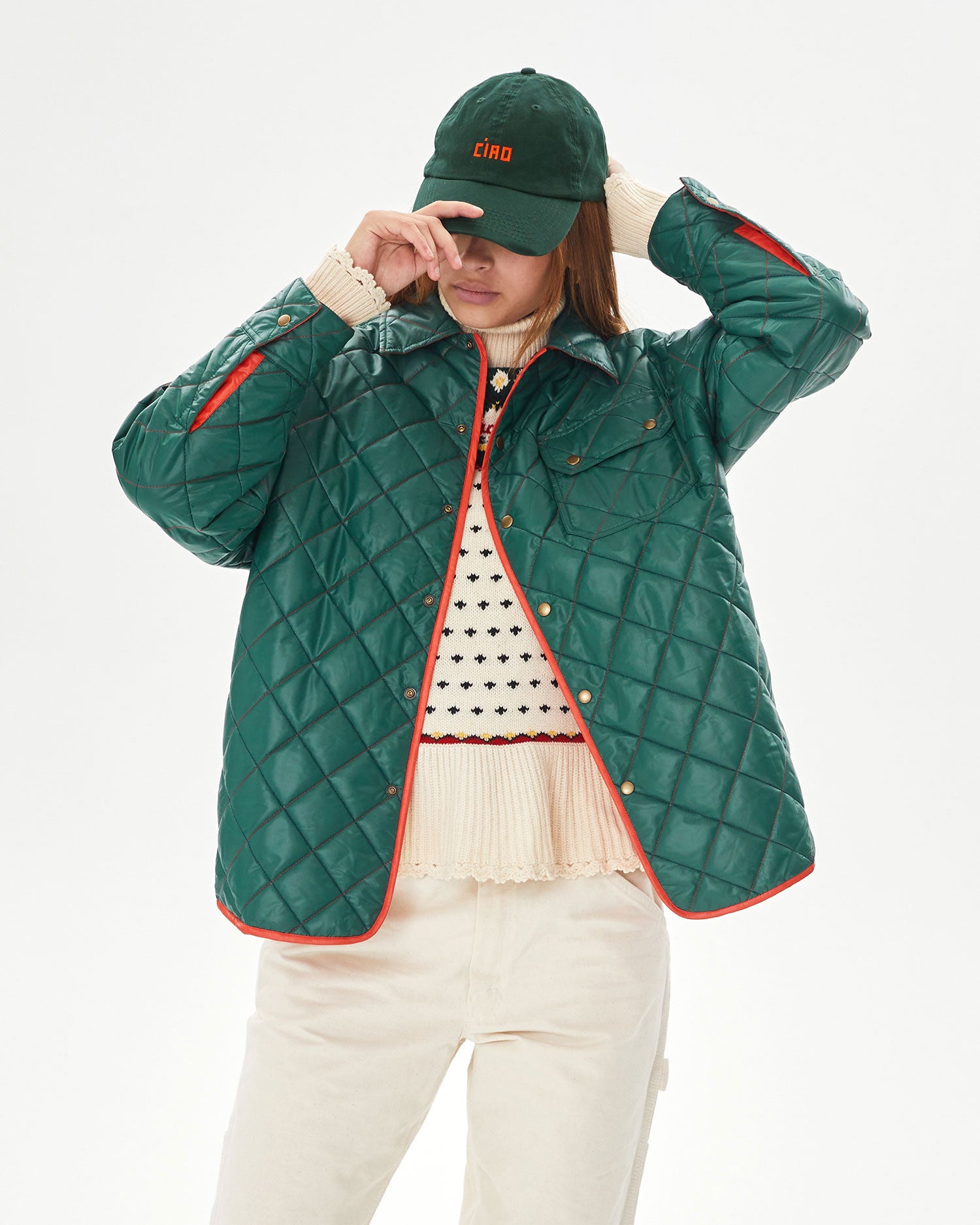 Aurelia putting on the Forest Green Ciao Baseball Hat