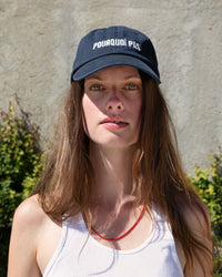 Gabrielle outside wearing the navy baseball hat with cream POURQUOI PAS