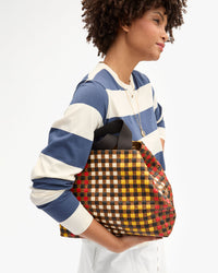 Lenny holding Bateau Tote up close