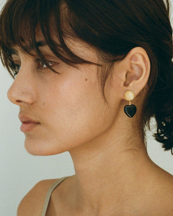 Black Heart Earrings on model