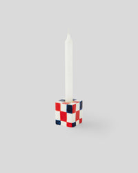 Navy and Poppy and Cream Checker Small Candlestick Holder with a white candle in it 