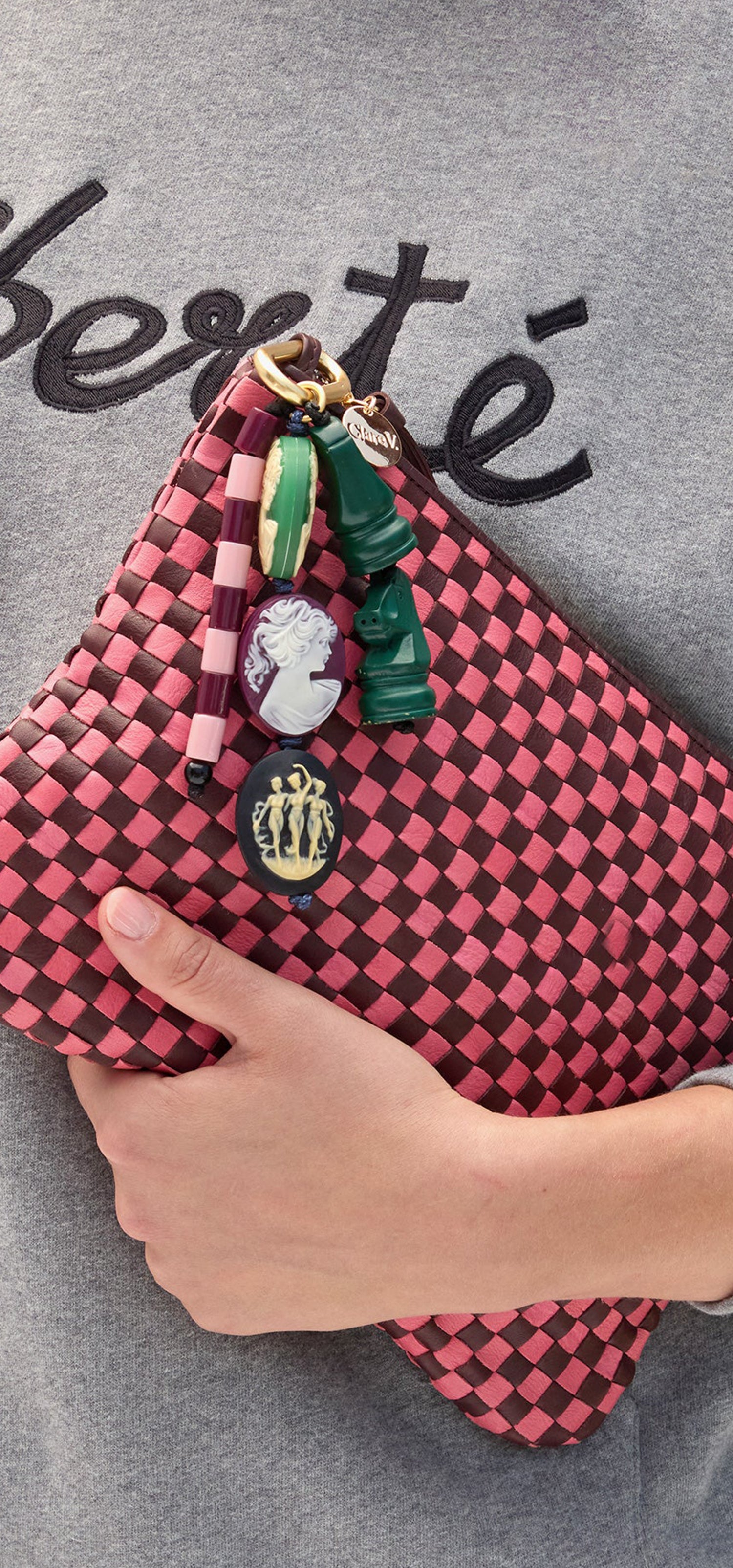 Flat Clutch with Bag Fob attached to it.