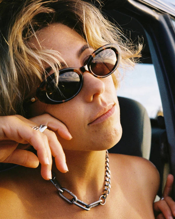 model wearing the CRAP Eyewear Sweet Leaf Sunglasses in Tortoise Bio