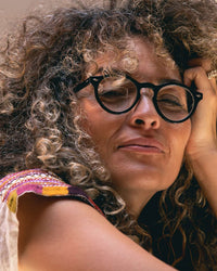 model wearing the Caddis Glossy Black Dogleg Readers
