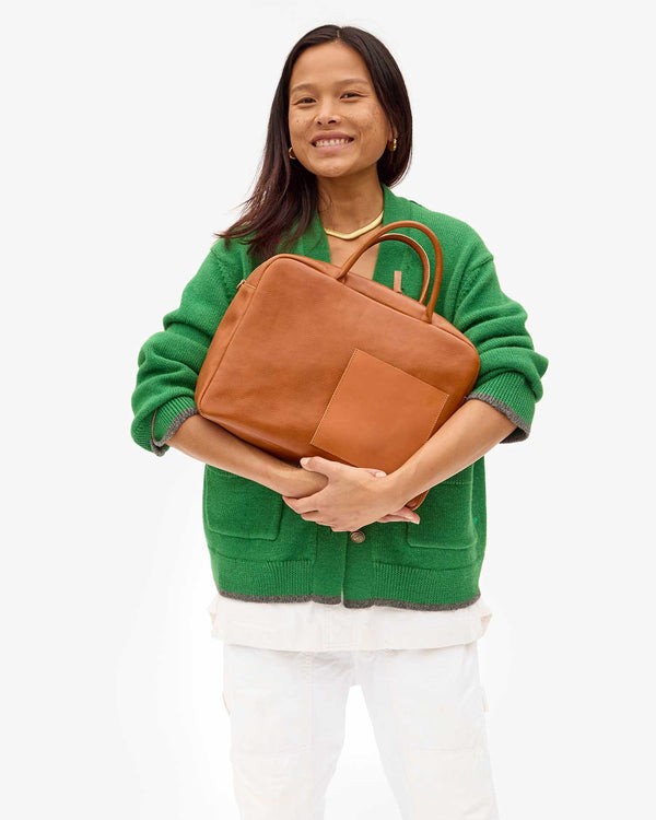 Maly holding the Miel Claude with both arms in front of her chest