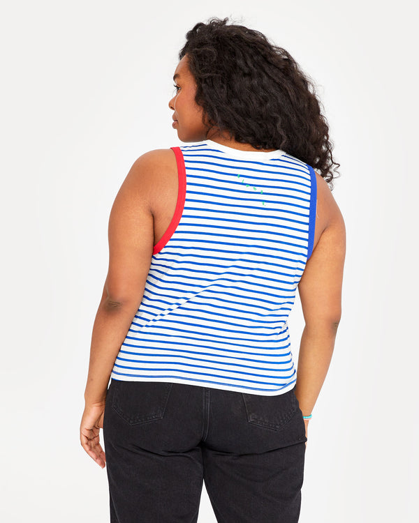 back view of candice in the Cobalt and Cream Petit Stripe Camp Fit Tank and black jeans