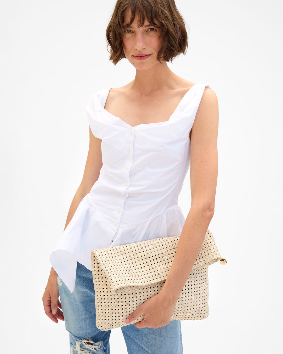Kathie holding Carryall Clutch