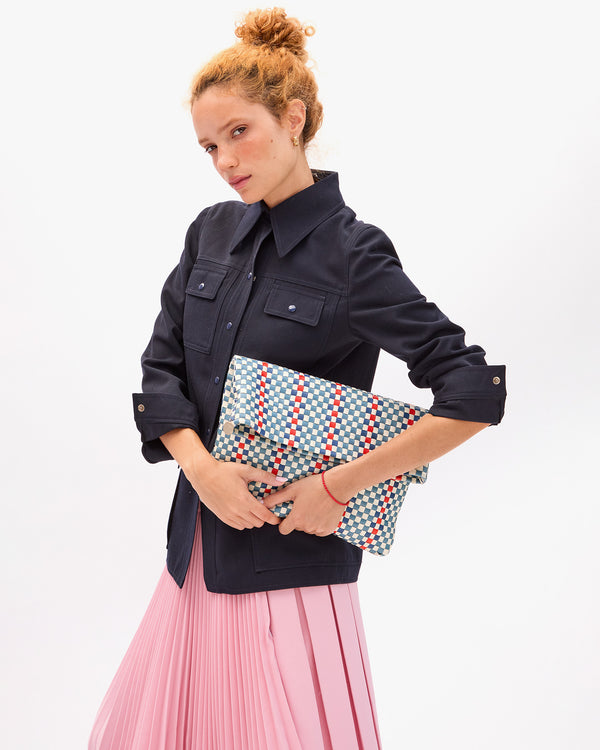 Laura holding Carryall Clutch