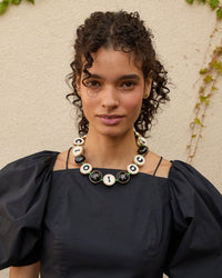 Haro wearing the Black Multi Ciao Collar with a black puff sleeve blouse