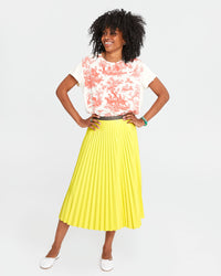 Mecca wearing the Classic Tee in Cream w/ Bright Poppy St. Calais Toile with a bright yellow pleated skirt