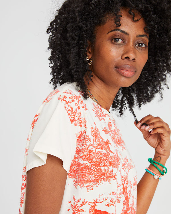 mecca wearing the Classic Tee in Cream w/ Bright Poppy St. Calais Toile. she's touching her hair