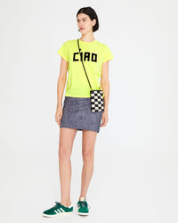athena wearing the  Neon Yellow w/ Ciao Classic Tee  with a mini skirt