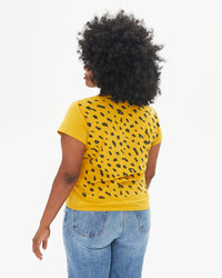 back view of candice in the Marigold Jaguar Classic Tee with jeans