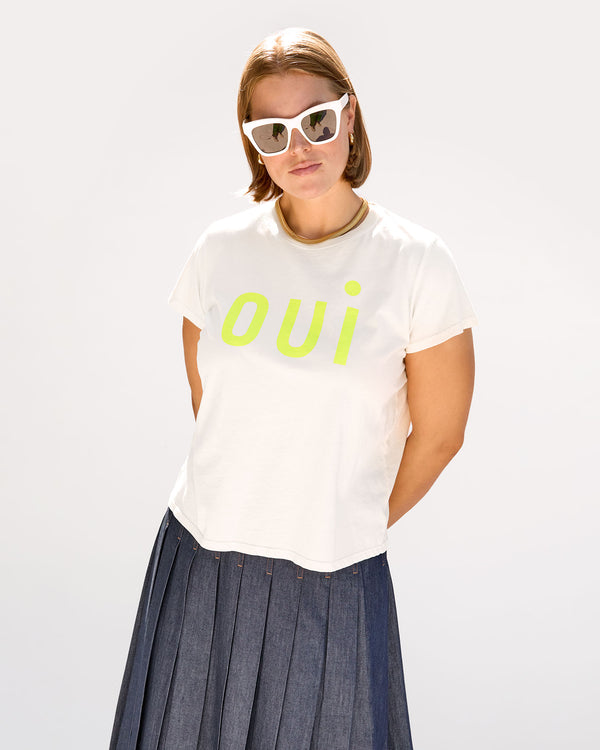 Sonnie wearing the Classic Tee in Cream with Oui with a pleated skirt