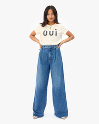 Maly with her hands on her hips in the Cream Oui Classic Tee and wide leg jeans