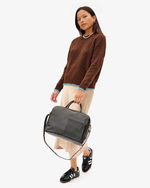 Maly holding the Black Claude in her hand