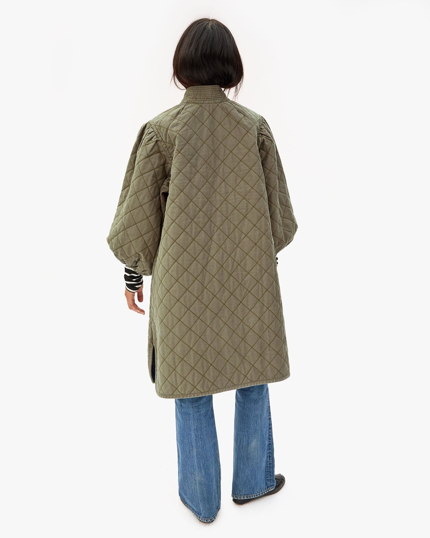 Back of Maly wearing the Olive Quilted Clemence Car Coat.