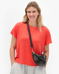 Elle wears the Petit Moyen with Veg Link Crossbody Strap