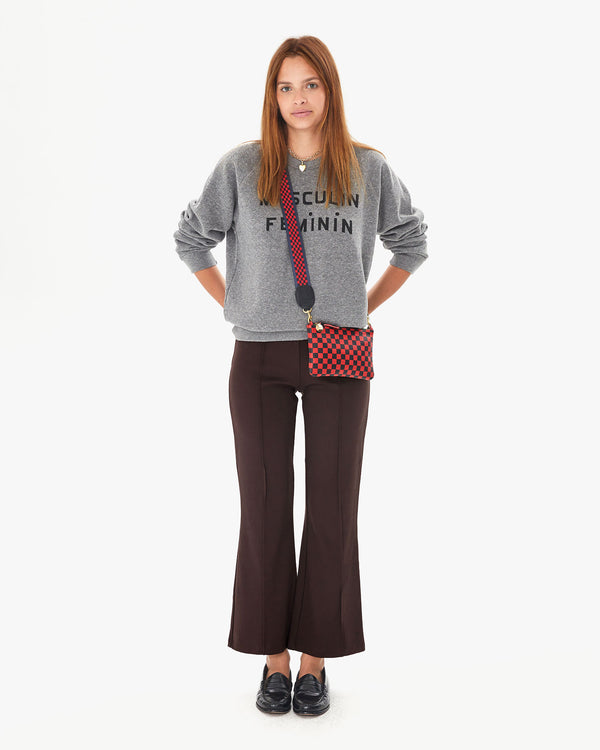 aurelia in the chocolate le flair pants and the grey masculin feminin sweatshirt with the Navy & Red Checker Crossbody Strap worn on the red and navy checker wallet clutch with tabs