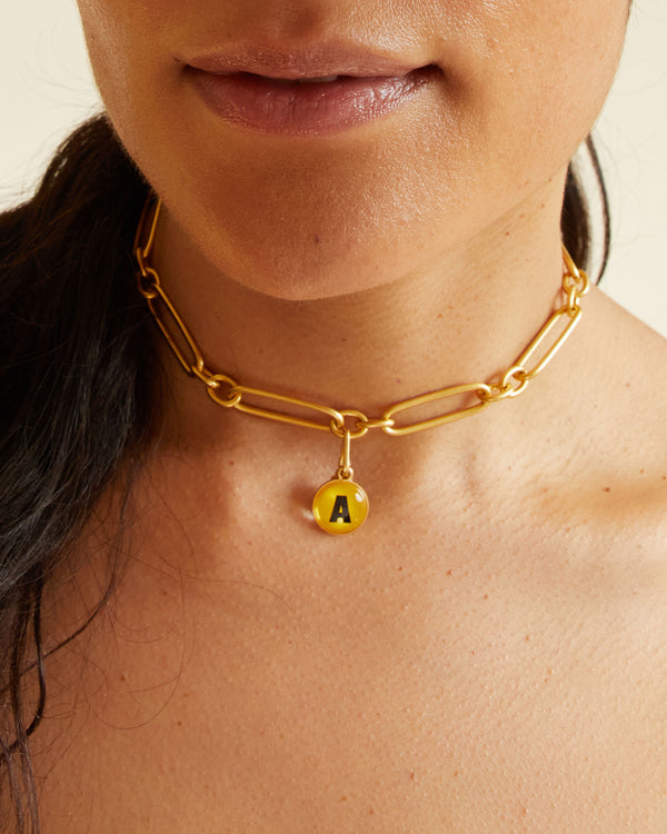 Andrea wearing the A alphabet charm on the convertible charm chain necklace styled as a choker