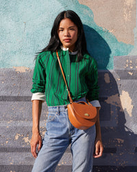 Sandra wearing the Green & Black Stripe Le Tux tucked into jeans