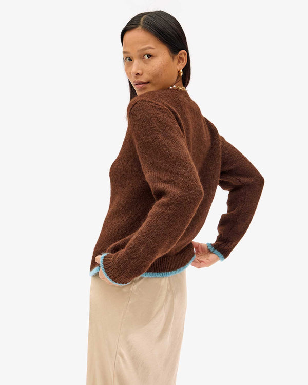 back view of Maly in the Chocolate Elsa Sweater