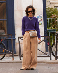 Gabrielle wearing the Sea Urchin Elsa Sweater tucked in to tan slacks