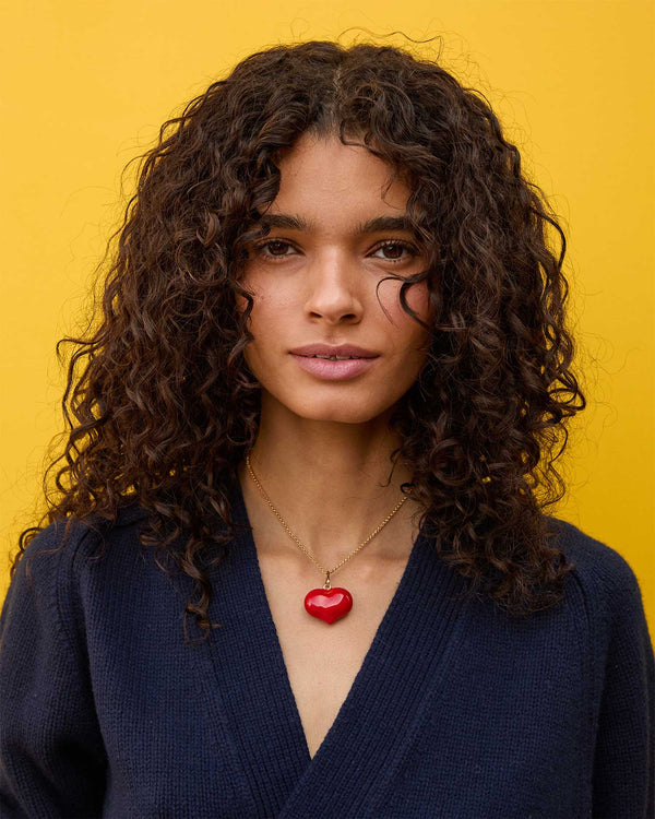 Haro wearing the Red Enamel Mylar Heart Charm on a gold chain 