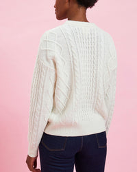 back view of the model wearing the Cream w/ Navy Charmant Fisherman Sweater with jeans