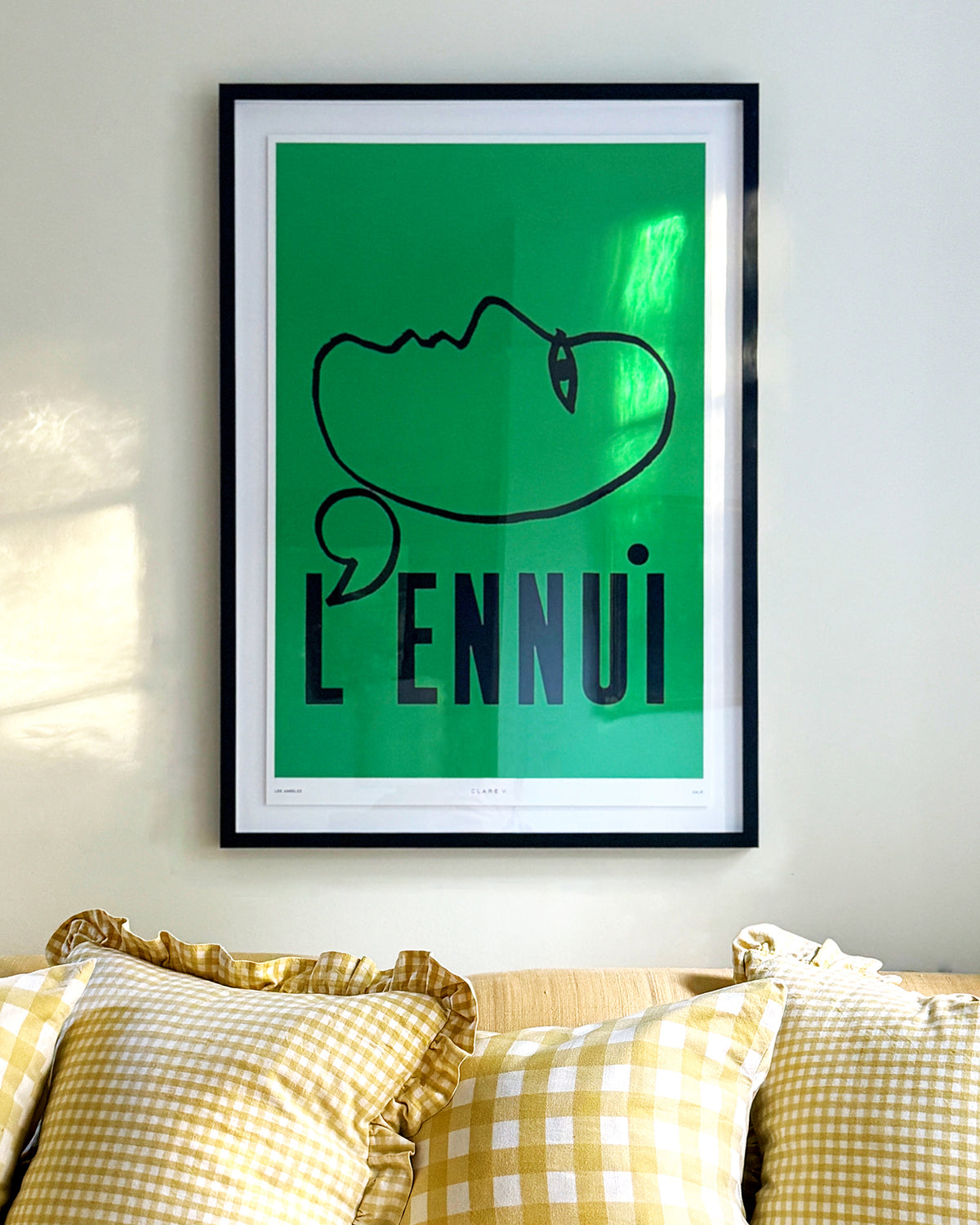 Clare V. x Framebridge L'Ennui Print on a black bordered frame