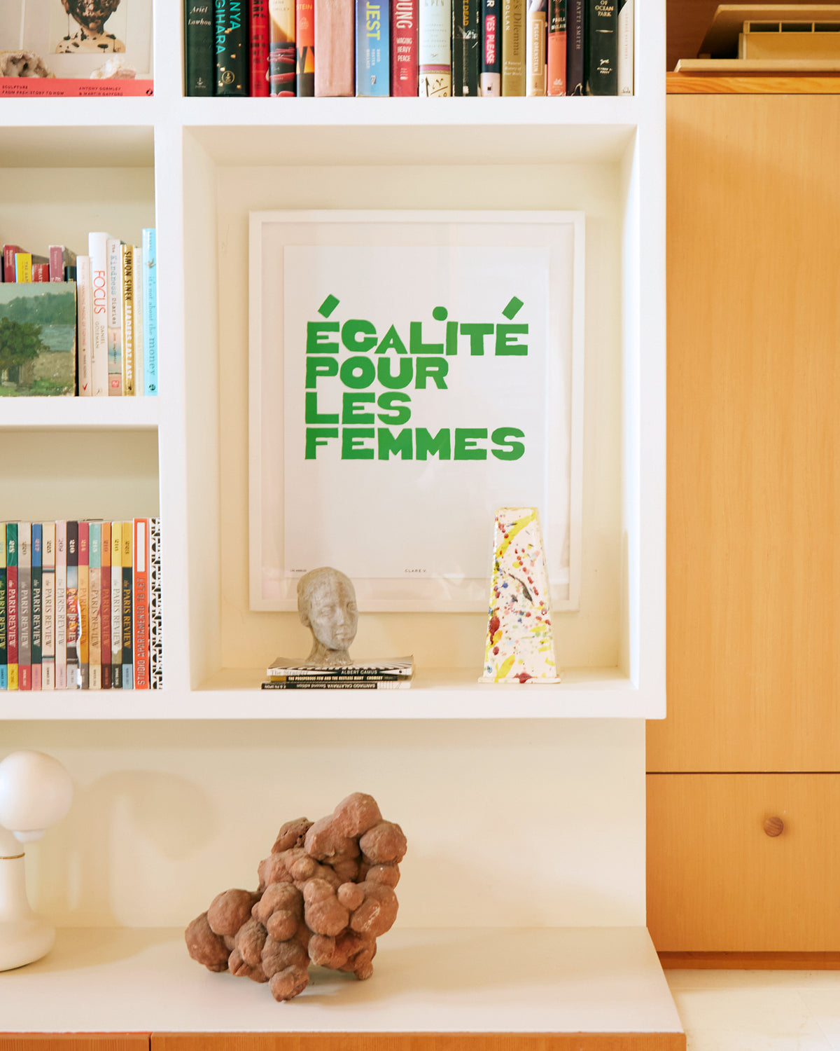 Clare V. x Framebridge Ègalité Pour Les Femmes print in a room cubby.