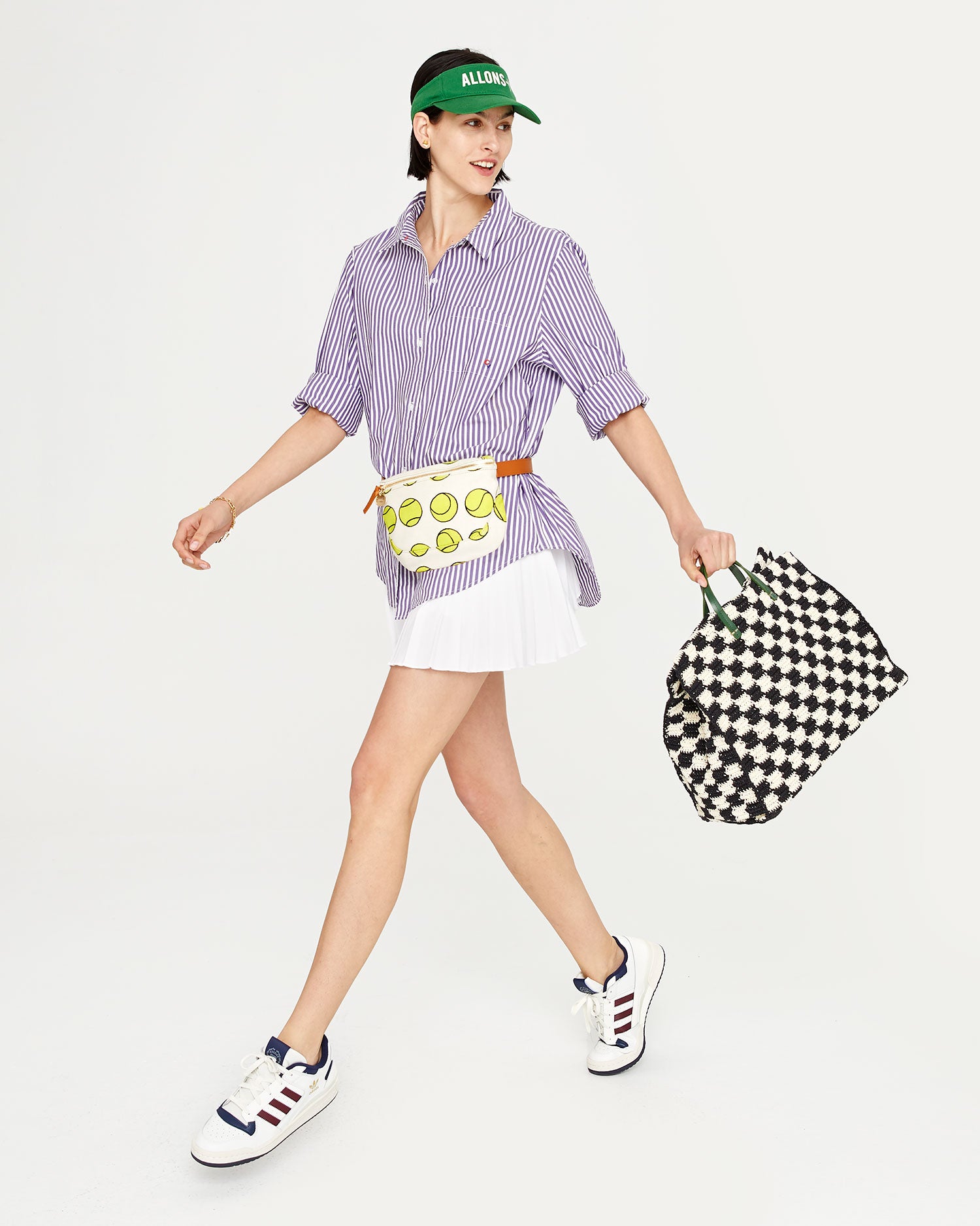 athena wearing the Natural with Tennis Balls Fanny Pack around her waist. she is also carrying the black and cream checker summer simple tote