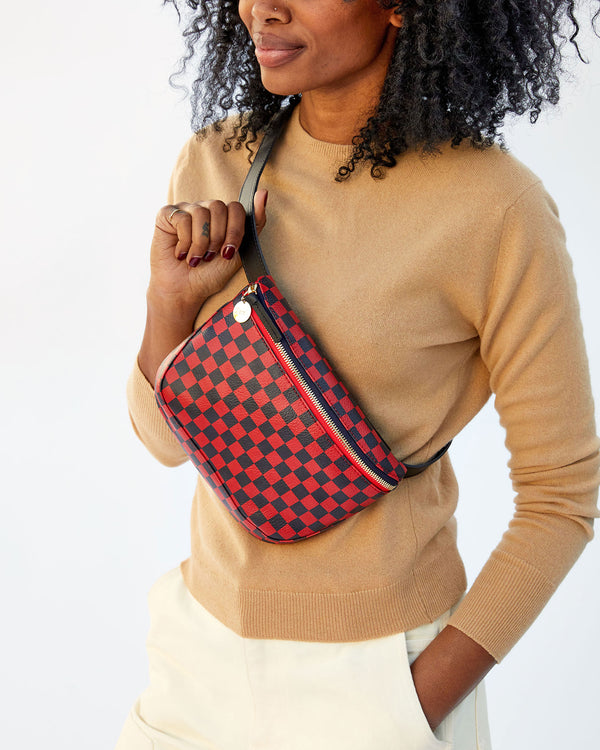 close up of the Cherry Red & Navy Checkers Fanny Pack worn by Mecca