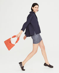 athena taking a big step with the Poppy & Khaki Checker Twisted Puff Top Handle and flat clutch with tabs