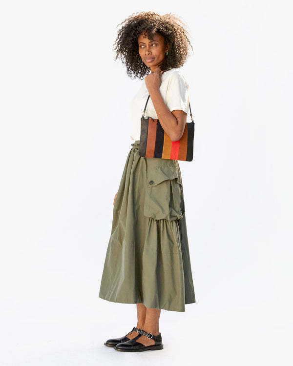mecca with the Suede / Nappa / Rustic Patchwork Flat Clutch with Tabs on her shoulder