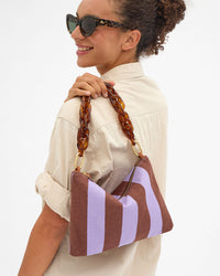 Flat Clutch w Tabs over Taliha's shoulder