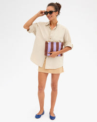 Taliha holding Flat Clutch w Tabs