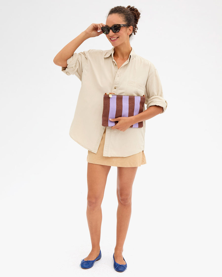 Taliha holding Flat Clutch w Tabs