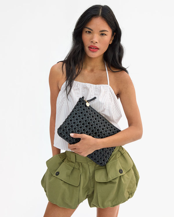 Sandra holding Flat Clutch w Tabs