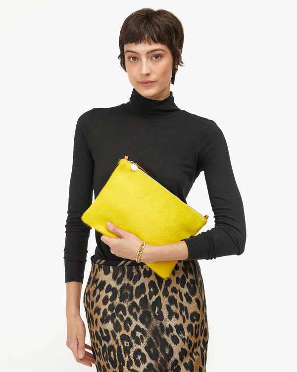 Nike holding Flat Clutch w Tabs