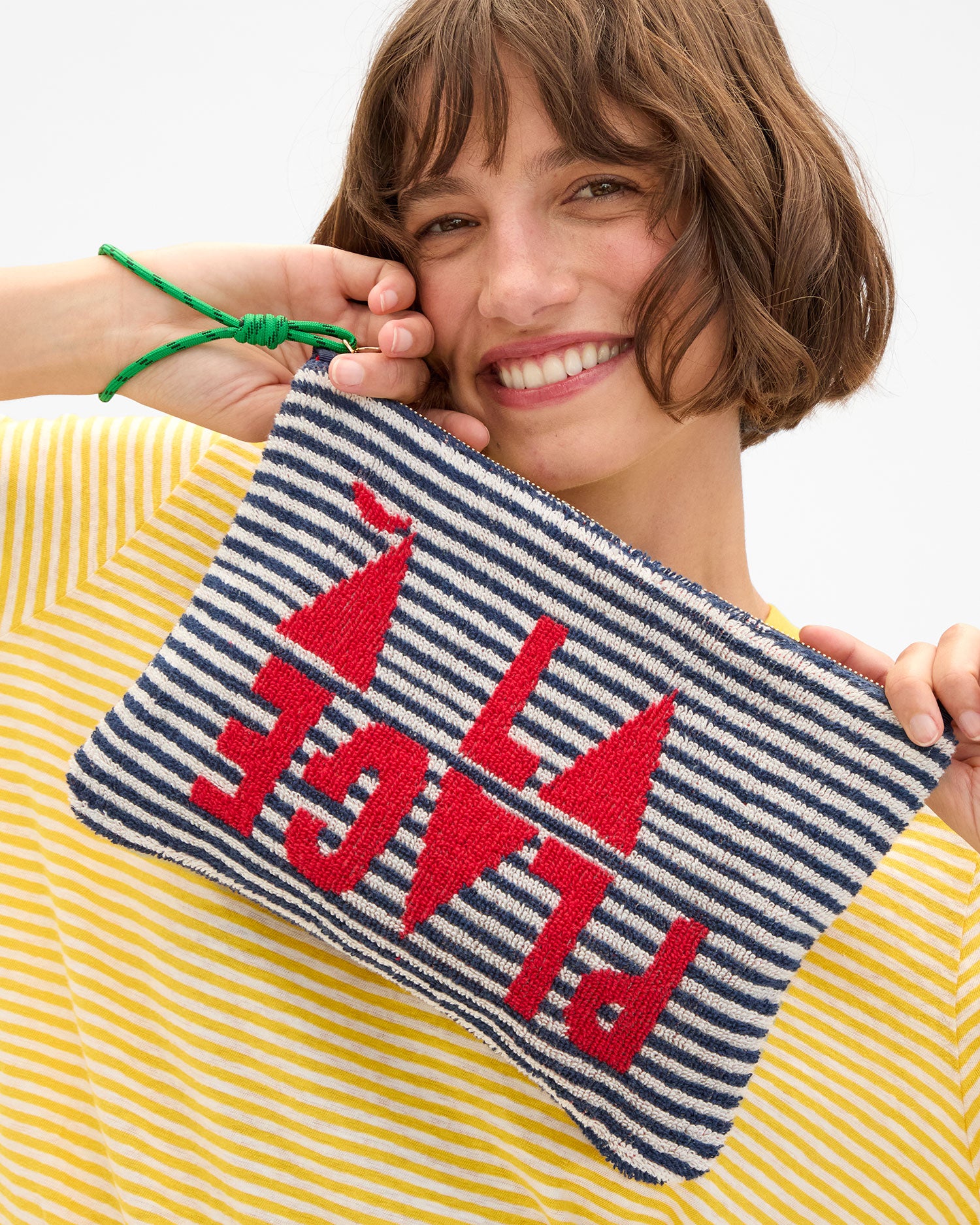 Kathie holding up Flat Clutch w Tabs