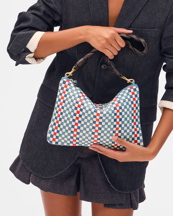 Lizzy holding Flat Clutch