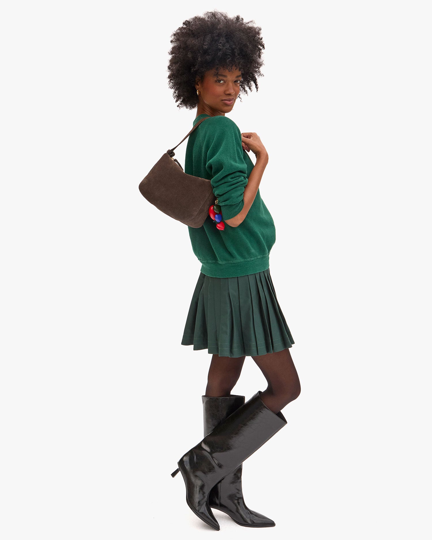 Full view of Angel carrying Fleurine in Chocolate Suede as a Shoulder Bag